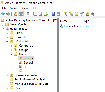 Active Directory Users and Computers showing departmental organizational units